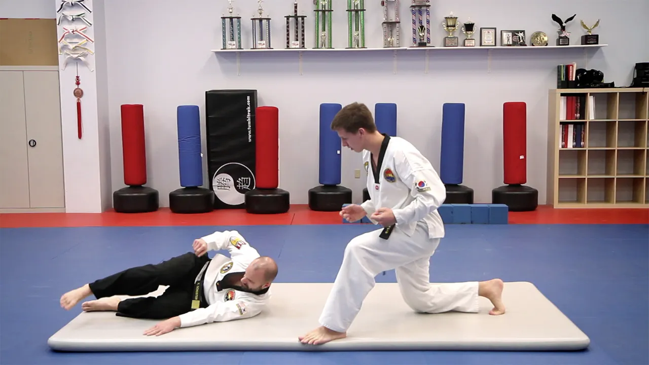Acrobatic one-handed handstand training on inflatable gym mats